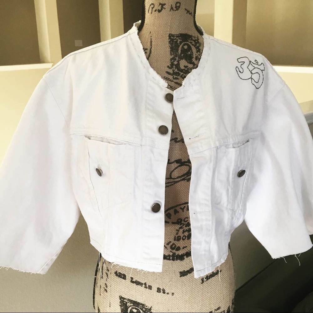 Vintage white jacket with holistic designs.
